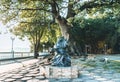 Gelendzhik, Russia, 27 May 2020: Sculpture Ã¢â¬ÅCat the ScientistÃ¢â¬Â near oak tree on embankment.